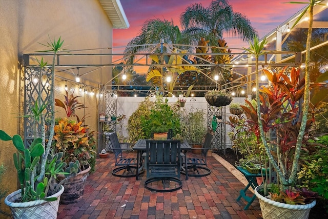 view of patio terrace at dusk