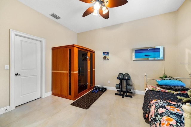 bedroom with ceiling fan and light tile patterned floors