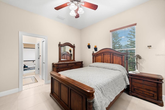 bedroom with ceiling fan and light tile patterned flooring