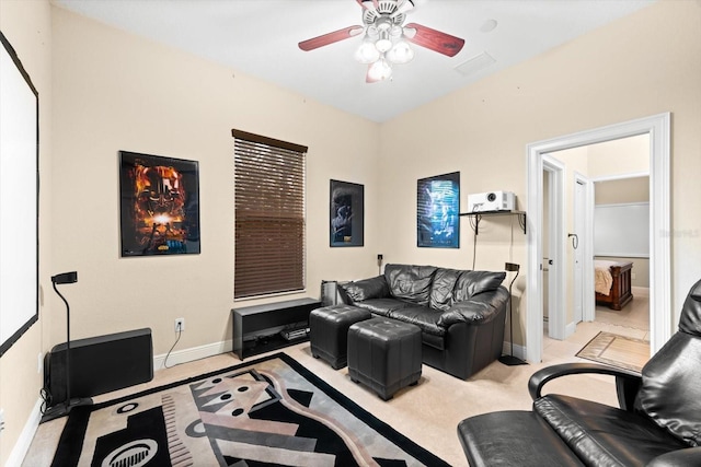 carpeted living room featuring ceiling fan