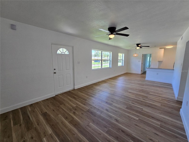 entryway featuring a textured ceiling, ceiling fan, and hardwood / wood-style flooring