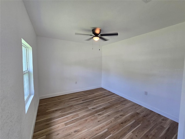 unfurnished room featuring ceiling fan and wood-type flooring