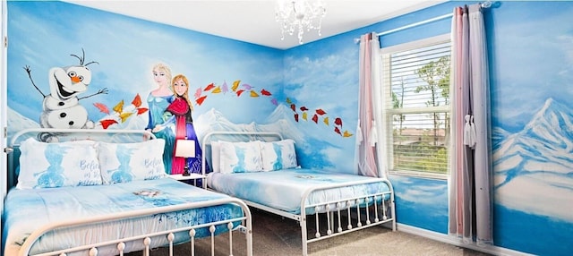 carpeted bedroom featuring a chandelier