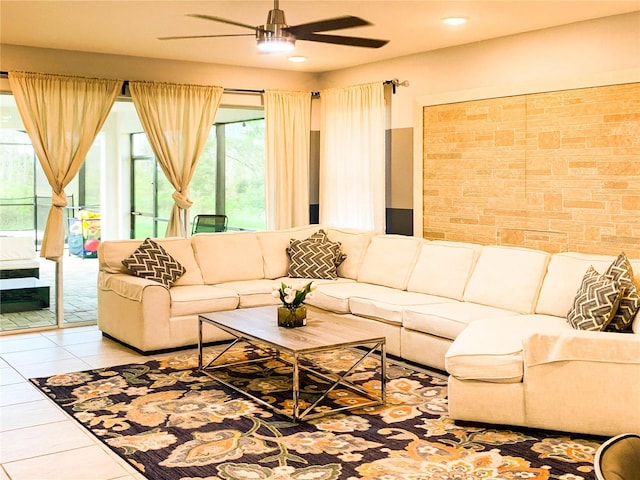 tiled living room featuring ceiling fan