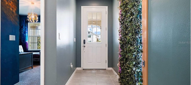 entryway with light tile patterned flooring