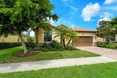 mediterranean / spanish-style home with a garage