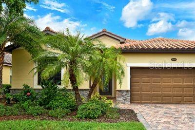 mediterranean / spanish-style home with a garage