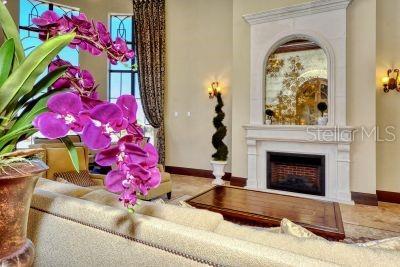 20635 Romagna Pl, Venice, FL 34293 - living area with a fireplace and baseboards