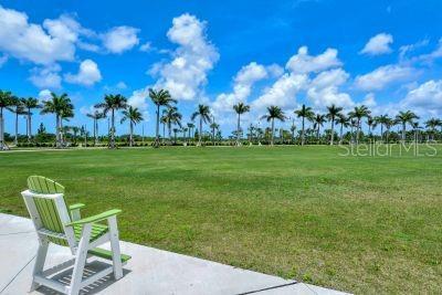 20635 Romagna Pl, Venice, FL 34293 - surrounding community featuring a lawn