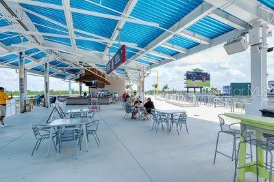 20635 Romagna Pl, Venice, FL 34293 - view of patio featuring a bar and outdoor dining space