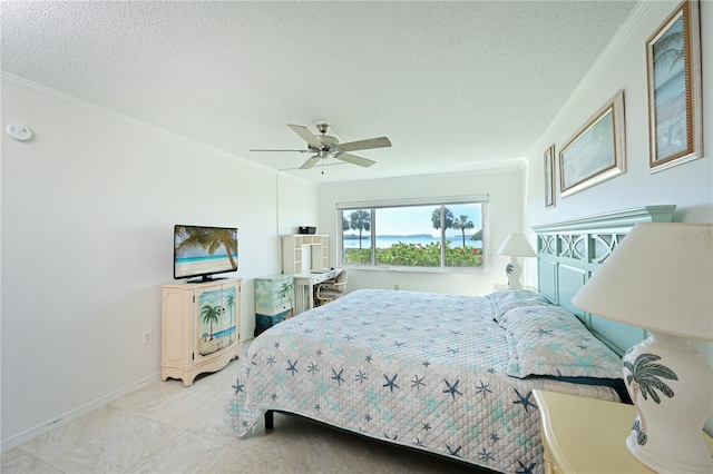 bedroom with a textured ceiling, ceiling fan, and ornamental molding