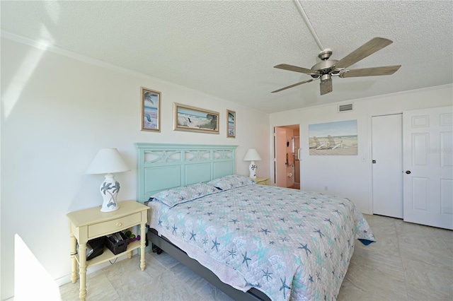 bedroom with ceiling fan, crown molding, and a textured ceiling