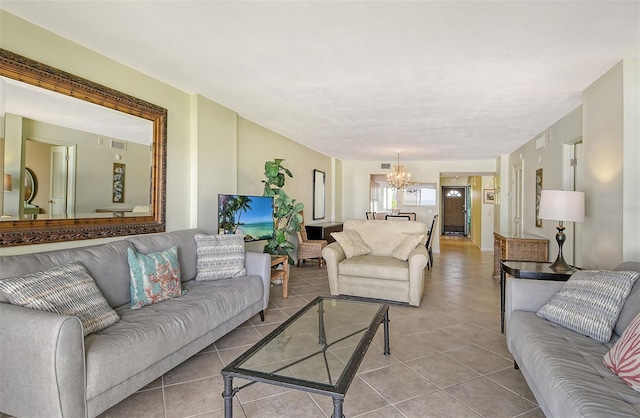 tiled living room featuring a chandelier