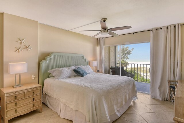 tiled bedroom with ceiling fan and access to exterior