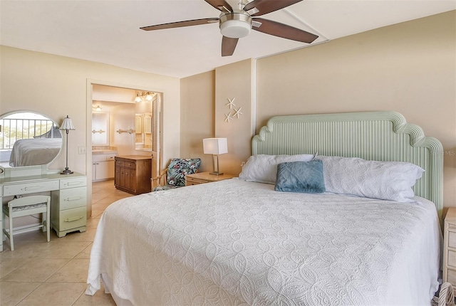 bedroom with ceiling fan, ensuite bath, and light tile patterned floors