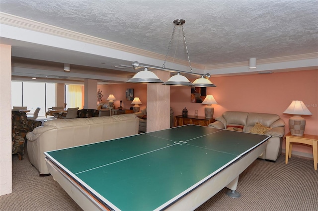 playroom featuring a textured ceiling, ornamental molding, and light colored carpet