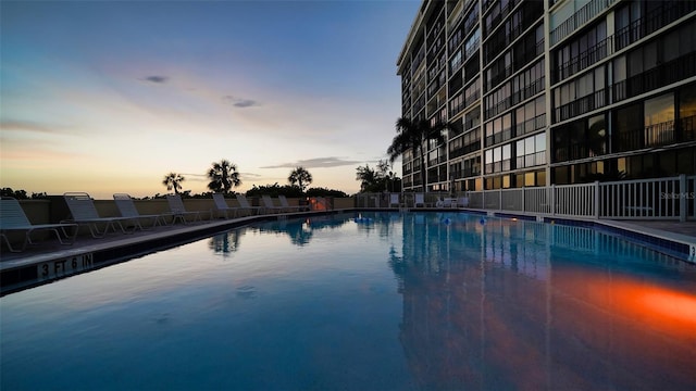 view of pool at dusk