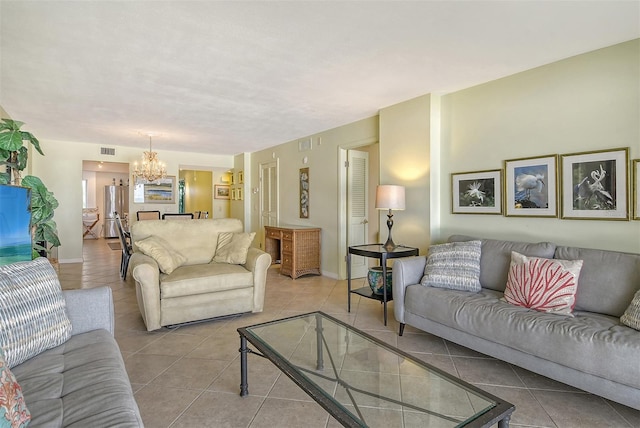 19 Whispering Sands Dr Unit 204, Sarasota, FL 34242 - tiled living room with a chandelier and baseboards