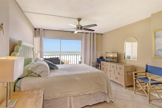 19 Whispering Sands Dr Unit 204, Sarasota, FL 34242 - bedroom featuring access to exterior, light tile patterned floors, and ceiling fan