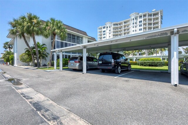 view of parking / parking lot with a carport