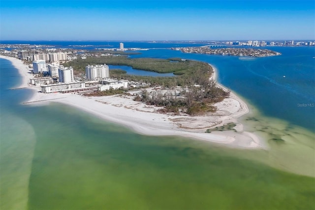 bird's eye view with a water view and a beach view