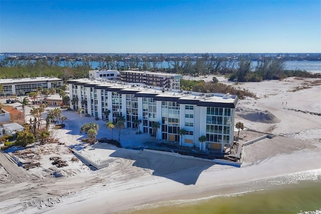 drone / aerial view with a view of the beach and a water view