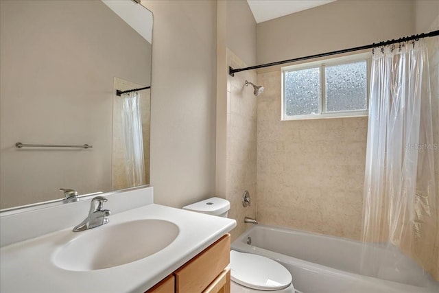 full bathroom featuring shower / bath combo with shower curtain, vanity, and toilet