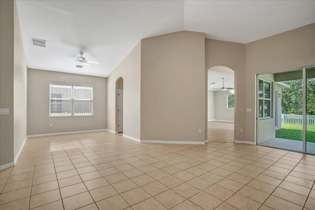 unfurnished room with ceiling fan and light tile patterned floors