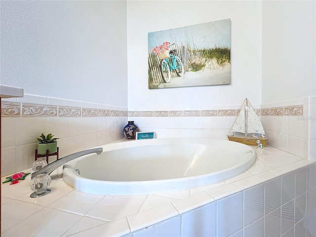 bathroom featuring a relaxing tiled tub