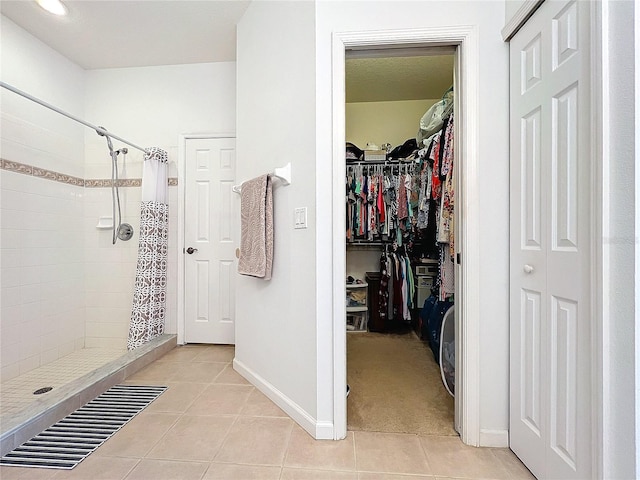 spacious closet with light carpet