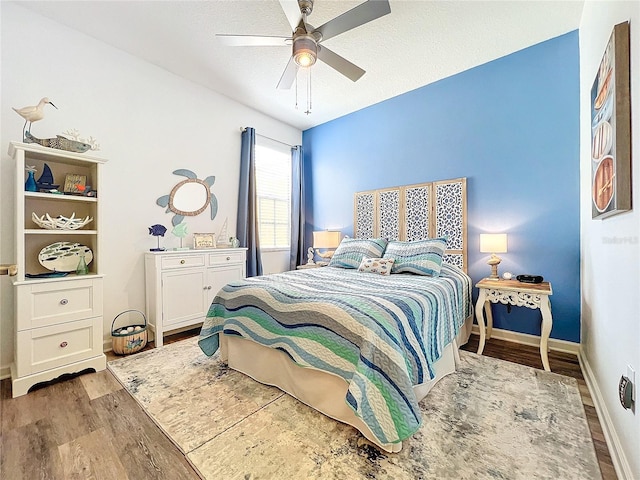 bedroom with ceiling fan and light hardwood / wood-style floors