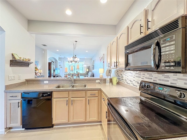 kitchen with light tile patterned flooring, sink, a notable chandelier, light brown cabinetry, and black appliances