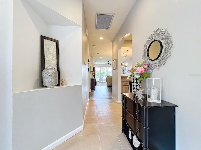 hallway with light tile patterned floors