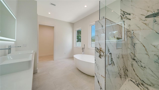 bathroom featuring independent shower and bath and tile patterned floors