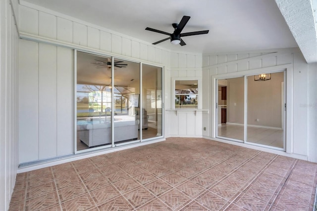 interior space with ceiling fan and vaulted ceiling