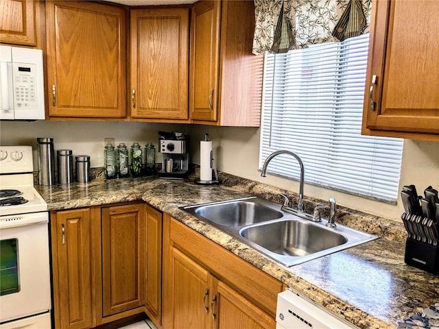 kitchen with sink and white appliances