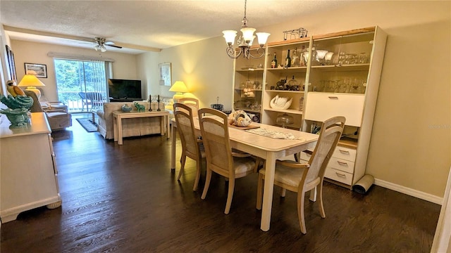 dining room featuring a textured ceiling, ceiling fan with notable chandelier, and dark wood-type flooring