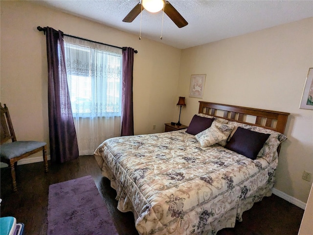 bedroom featuring ceiling fan, a textured ceiling, and hardwood / wood-style flooring