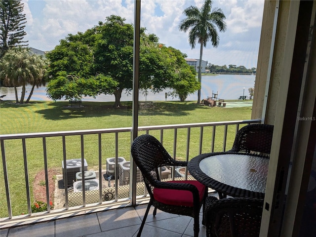 balcony featuring a water view