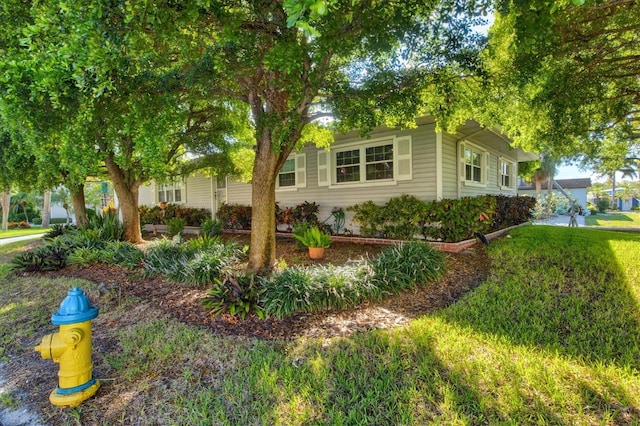 view of property exterior with a yard