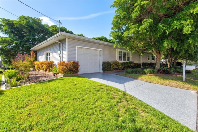 ranch-style house with a front yard and a garage