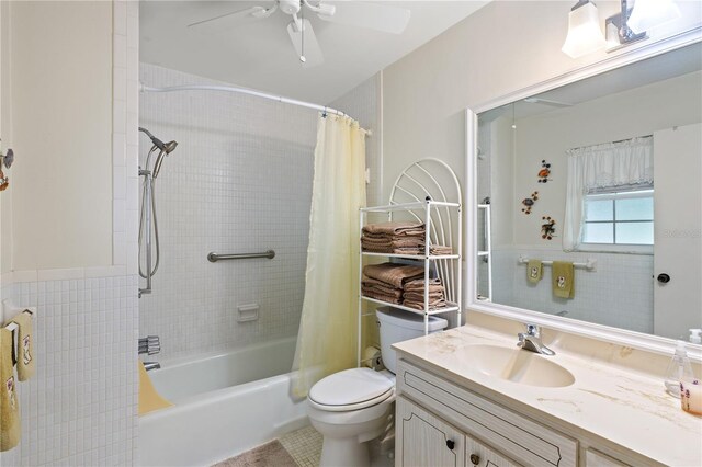 full bathroom with tile patterned floors, toilet, shower / tub combo, ceiling fan, and vanity