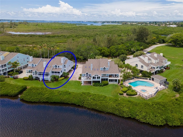 birds eye view of property with a water view