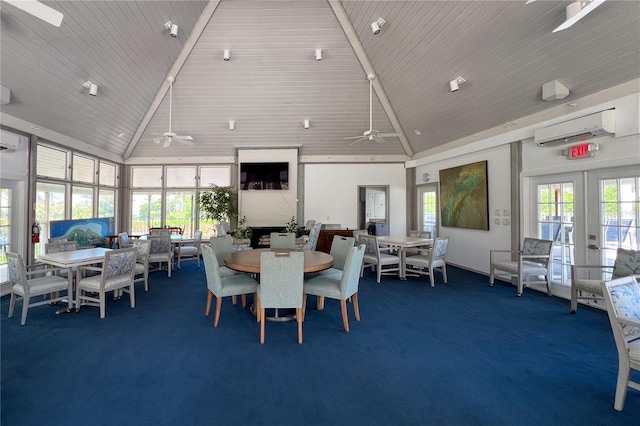 carpeted dining space featuring a wall unit AC, ceiling fan, french doors, and high vaulted ceiling