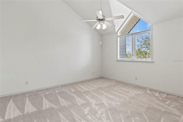 empty room featuring light carpet, ceiling fan, and lofted ceiling