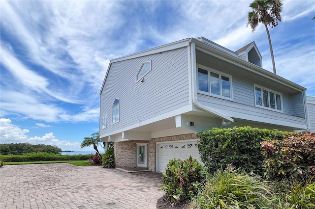 view of property exterior featuring a garage