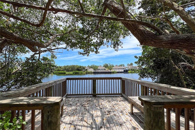 wooden deck with a water view