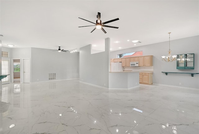 unfurnished living room featuring ceiling fan with notable chandelier and light tile patterned flooring