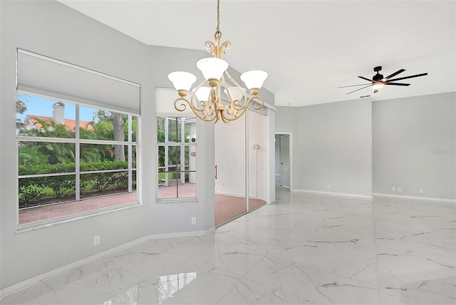 unfurnished dining area featuring ceiling fan with notable chandelier, marble finish floor, and baseboards