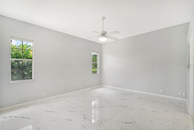 unfurnished room featuring ceiling fan and light tile patterned floors